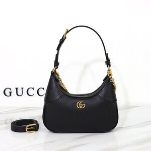 Gucci Black Shoulder Bag with Gold Accents